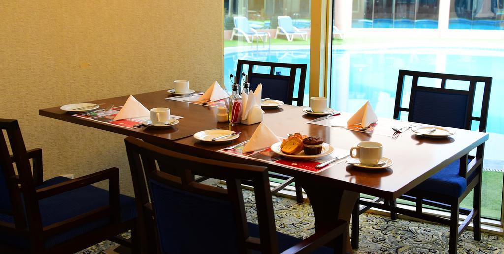 Ramada Hotel & Suites By Wyndham Al Qassim Аль-Букайрия Экстерьер фото A table set for afternoon tea